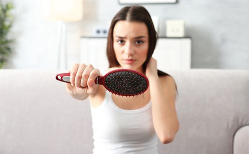 Woman shows a comb