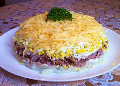 Meat salad sprinkled with cheese