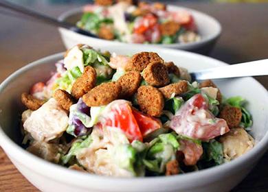 Bowl of Salad with Beans, Croutons and Tomatoes