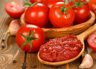 Tomatoes and tomato paste in a wooden spoon