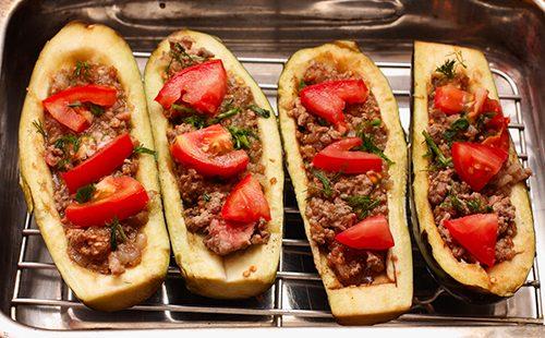 Eggplant with meat on a metal baking sheet