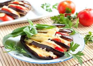 Baked eggplant with cheese and tomatoes on a plate