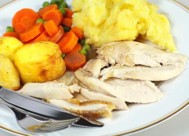 Boiled chicken breast with potatoes and vegetables