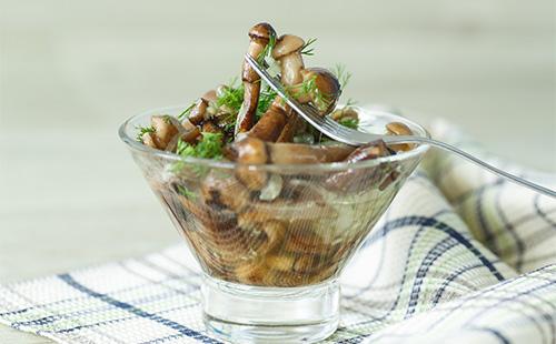 Pickled mushrooms in a glass bowl