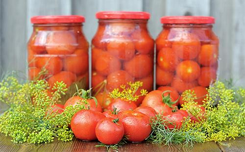 Pickled tomatoes in jars