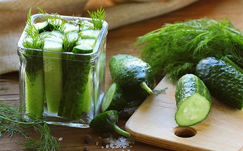 Halved cucumbers in jars