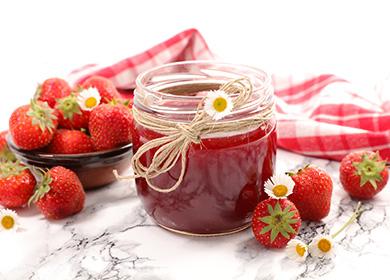 Strawberry jam in a jar on the table