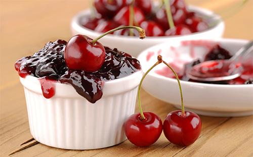 Cherry jam in a bowl on a table
