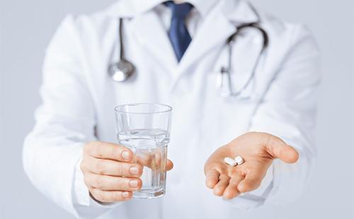 Pills in doctor's hand