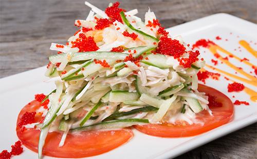 Vegetable salad with red caviar