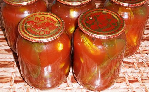Jars of cucumbers in tomato sauce in jars