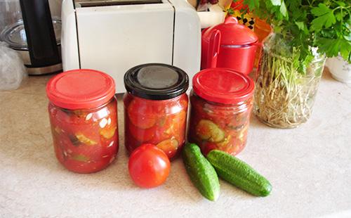 Jars of pickled cucumbers with ketchup chili