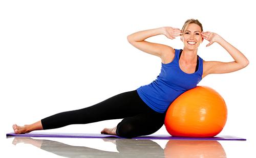 Woman doing fitball exercises