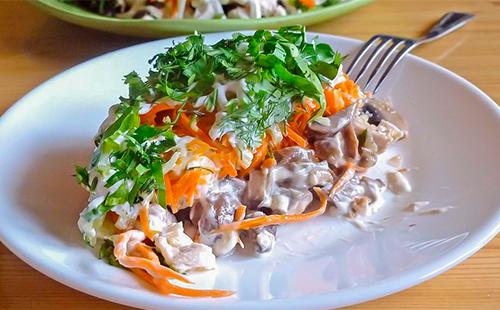 Salad with carrots, cheese, mushrooms and chicken