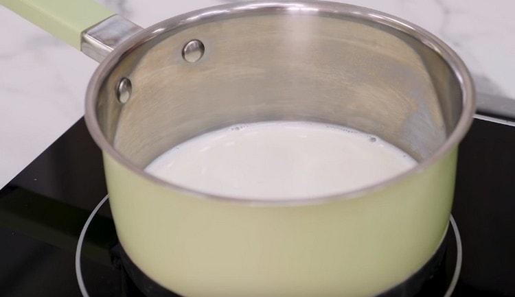 To prepare the cream, you need to warm the milk.