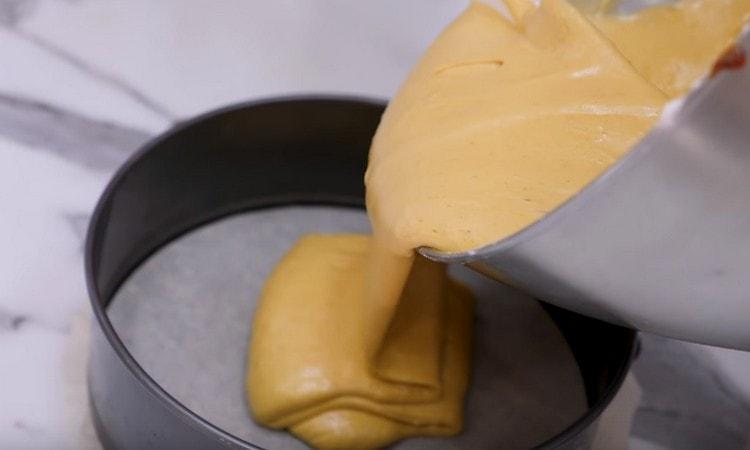 Pour the dough into parchment-covered forms.