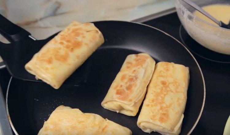 Pancakes prepared with this recipe with ham and cheese will be tastier if you fry them in butter before serving.