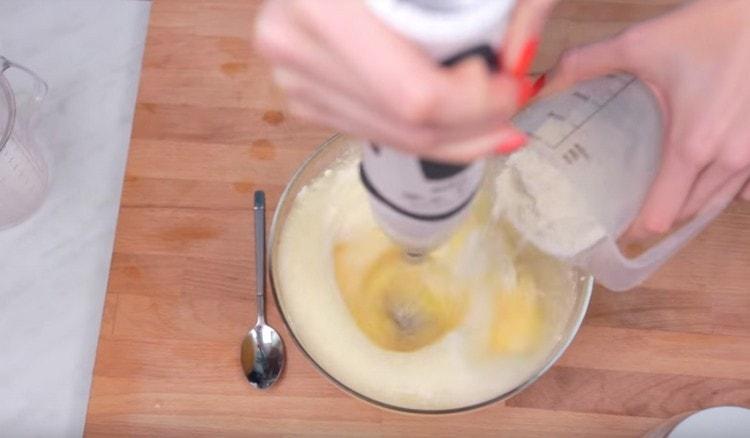 Add flour and beat the dough until smooth.