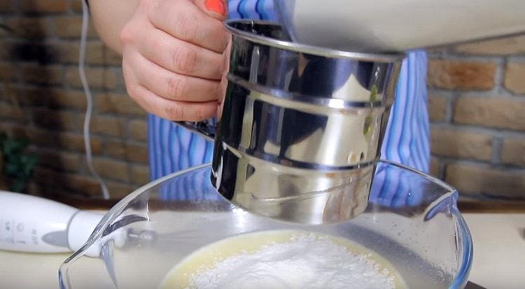 Sift flour into the dough.