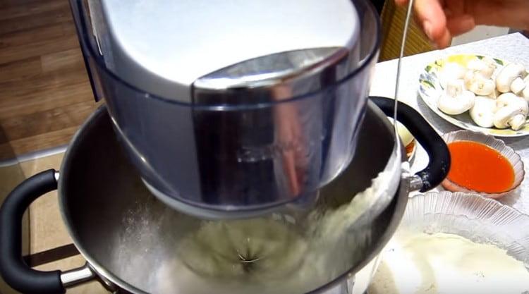 It is convenient to beat the dough with a mixer.