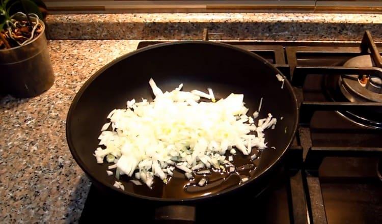 First, fry finely chopped onions in a pan.