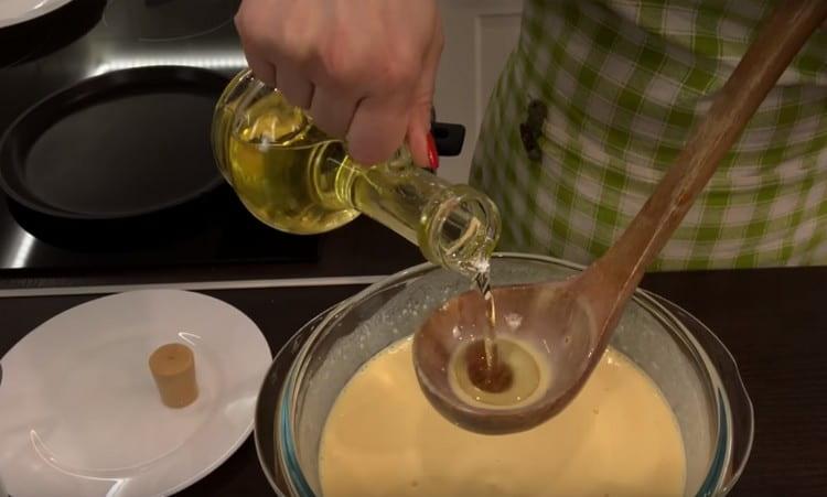 Before frying the pancakes, add vegetable oil to the dough and mix.