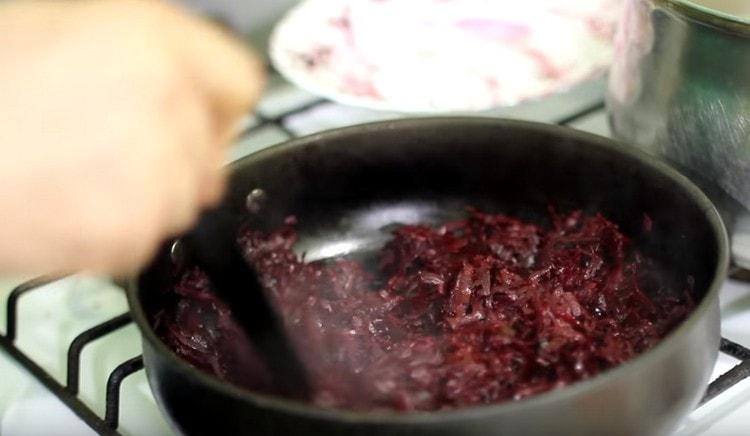 Rub the beets on a coarse grater and sauté it in a pan with vegetable oil.