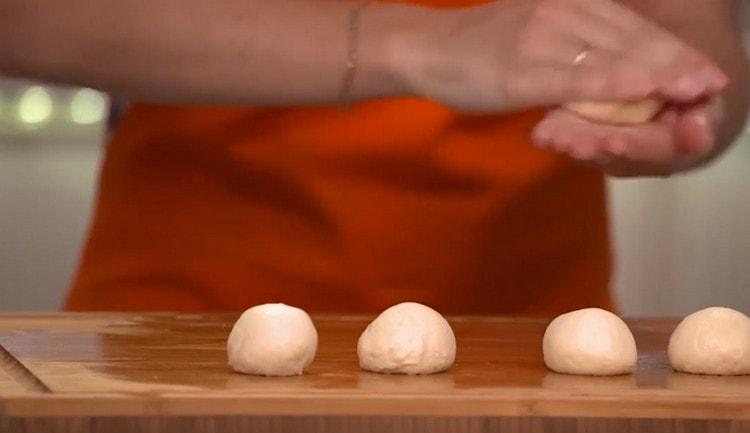 When the dough rises, we crush it and form dumplings.