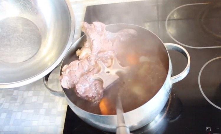 Ready meat and vegetables are extracted from the broth.