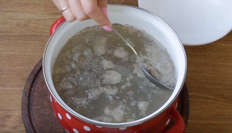 After boiling, remove the foam from the broth.