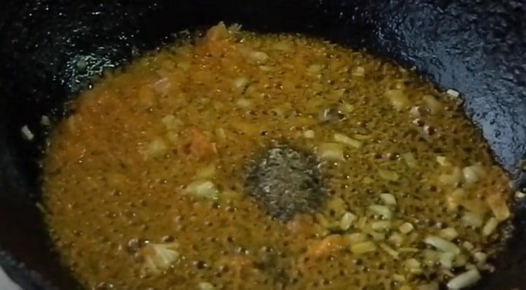 To the carrots in the pan, add carrots, as well as spices to taste.