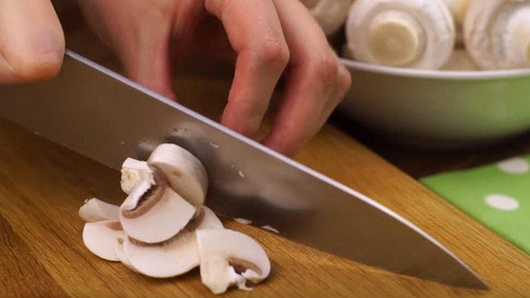 We cut champignons with slices.