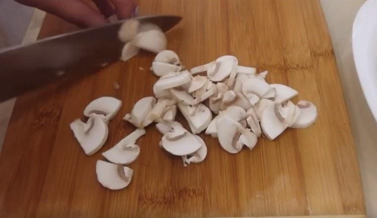 We cut champignons into thin slices.