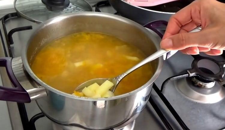 Cook the soup until the potatoes are ready.