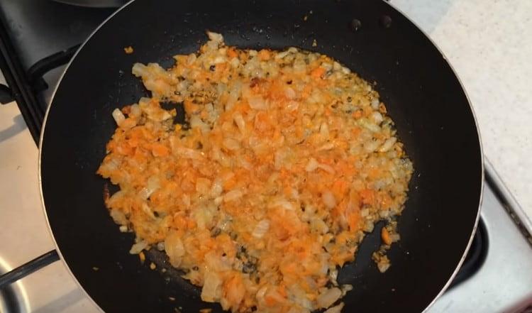 Fry the onions and carrots for another minute.