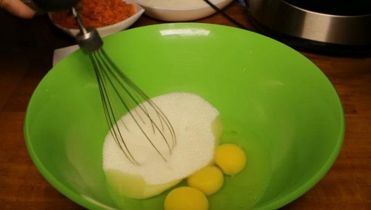 Pour sugar into the eggs.