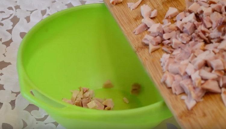 We shift the chopped chicken meat into a deep bowl convenient for mixing the salad.