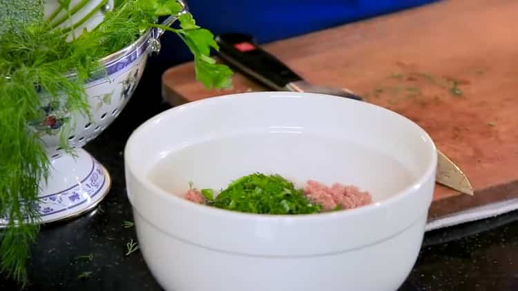 To cook turkey meatball soup, chop greens