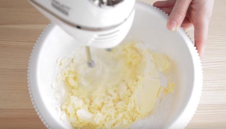 Beat butter with powdered sugar.