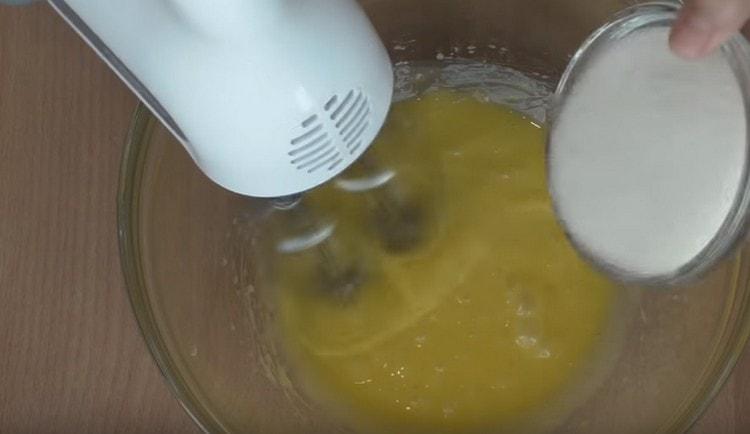 Beat the yolks, adding sugar to them.