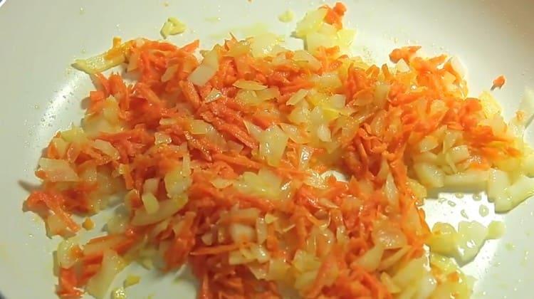 Add the carrots to the onion and sauté all together.