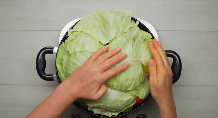 To cook a vegetable stew with meat, cover the stew with cabbage leaves