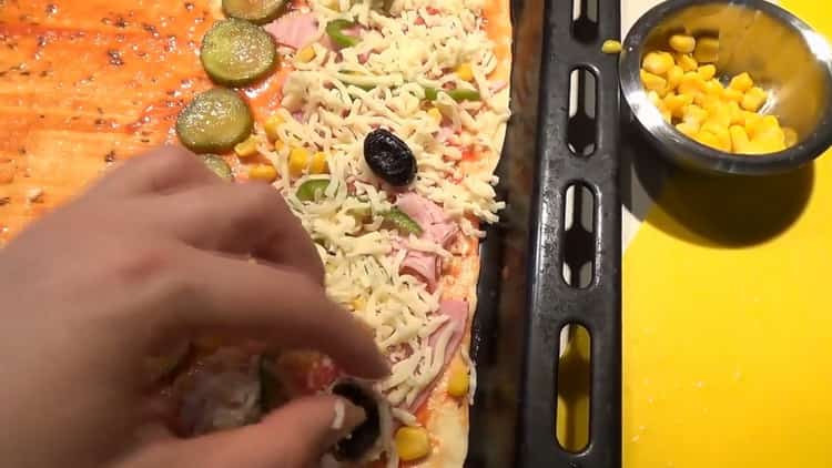 To make pizza toppings, grate cheese