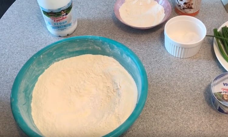 Combine the sifted flour with salt and soda.