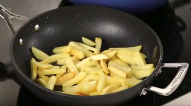 Fry the potatoes until golden brown.