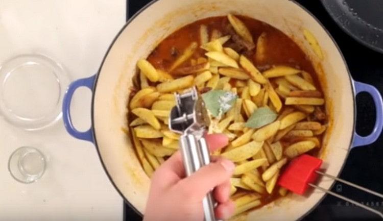 Add salt, pepper, squeeze the garlic.