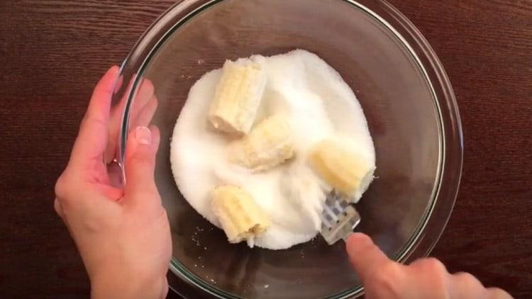 Knead a banana with honey and sugar.