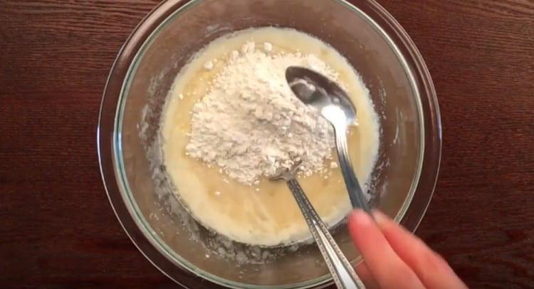 Gradually introduce flour into the dough.