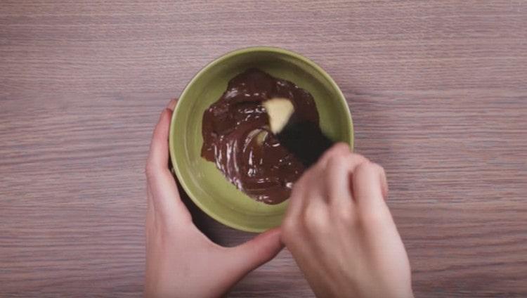 Melt the chocolate and add the butter.