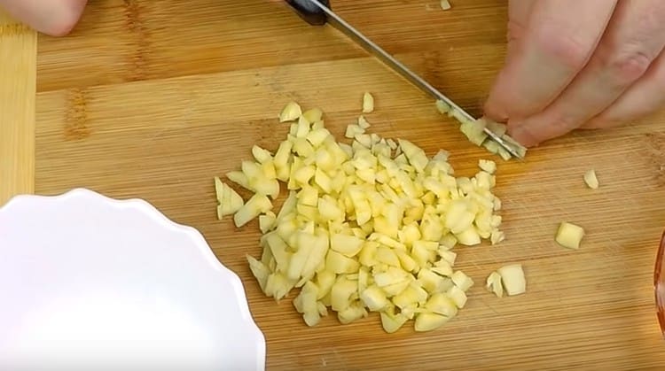 Grind a head of garlic.